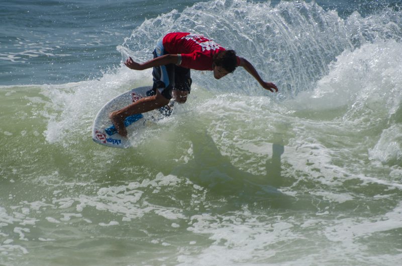 Skimboard on the beach waves